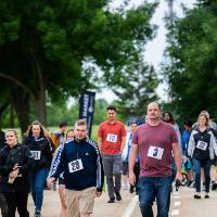Group of GVSU employees walking and talking during the race